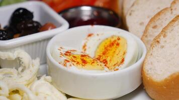 Delicious breakfast spread with eggs, bread, and vegetables video