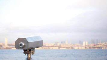Enjoying coastal views through a telescope by the waterfront video