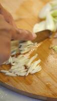 Mastering the art of slicing vegetables in a kitchen setting video