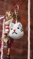 Cute handmade cat keychain showcased at a local market stall video
