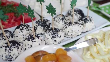 Tasty snacks arranged on a table feature creative garnishes and flavors.. video