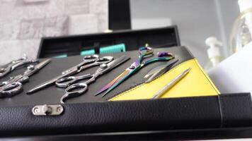 Exploring hairdressing tools and accessories in a salon video
