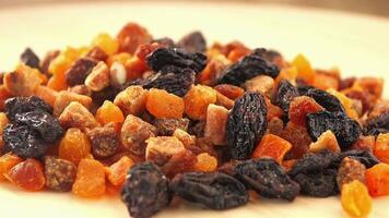 Dried fruits and nuts mix served in a colorful display bowl video