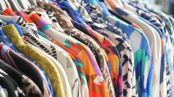 Colorful collection of summer shirts displayed in a retail setting video