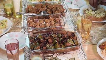 Delicious spread of dishes at family gathering in cozy setting video