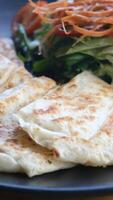 Enjoying fresh turkish borek with a side of crisp salad video