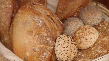 Freshly baked bread varieties in a rustic basket display video