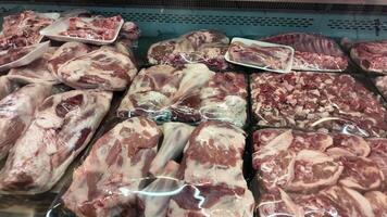 Fresh meat selection at local grocery store in morning hours video