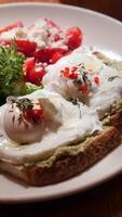 Delicious poached eggs on avocado toast with fresh salad video