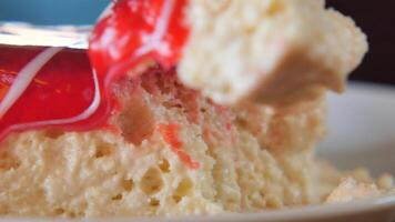 Delicious dessert topped with bright red glaze served in a cafe video
