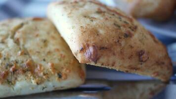 Freshly baked flatbreads with herbs and spices at local bakery video