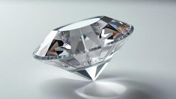 Single transparent diamond with a brilliant cut on a soft gray background photo
