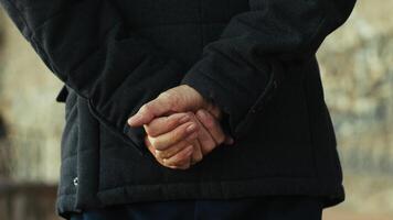 Hand Of An Elderly Country Gentleman Moves In Silhouette In The Village Close up photo
