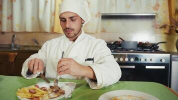 Close up Humble Man Chef Eats Food At Home Before Service At Private Restaurant photo