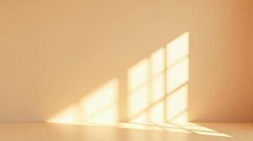 Sunlit window casting geometric shadows on a soft, peach-colored wall. photo