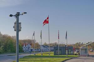 Flags and surveillance camera along a Road in Denmark photo