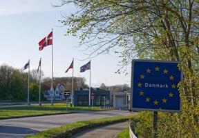 Border Crossing into Denmark with Flags and EU Sign photo
