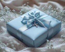 Beautiful baptismal gift box adorned with delicate ribbon and charm, perfect for a cherished celebration of faith and love photo
