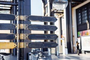 Blank directional sign with decorative elements in urban setting during daylight hours photo