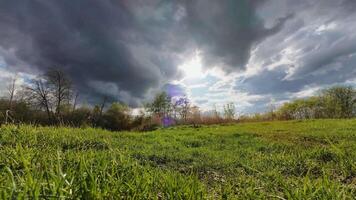Stunning photographs capture a vibrant green field under a dynamic sky filled with enchanting clouds, showcasing natures beauty and inviting viewers to appreciate the splendor around them video