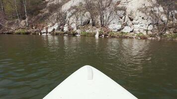 A view of the front of a kayak from the water video