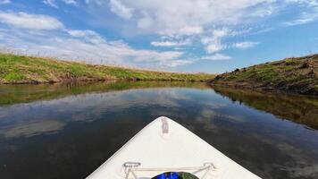 A kayak on the water with a blue sky video