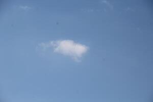 a white cloud in the sky photo