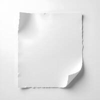 A torn white paper sheet isolated on a white background photo