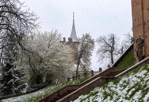 House with a spire in an old style in the center of Kyiv in early spring photo