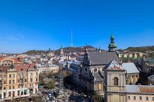 A view of Lvivs charming old town center with classic buildings and bustling street life. photo