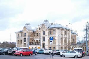 Grodno, Belarus, 03.01.2025 A large building with a clock on the front photo