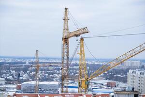 A construction site with a crane in the middle of the scene photo