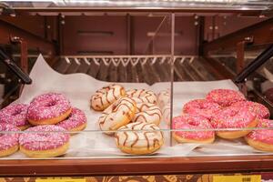 Various color donuts in window photo