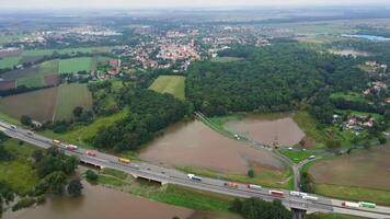 Aerial view of flooded fields near busy highway. Concept of climate impact, transportation disruption and natural disaster video