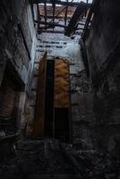 Fire aftermath, burnt building, charred walls in black soot photo