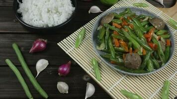 Oseng buncis or stir fried french bean or green bean with meatball and carrot Javanese food video