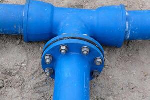 Cast metal pipe connection with flange. photo