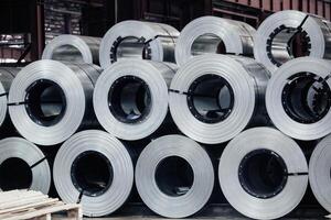 Rolls of galvanized steel sheet inside the factory or warehouse.. photo