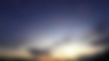 Abstract Sunrise Blurred Image with Dark Sky and Soft Light photo