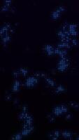 Abstract vertical 4K animation featuring blue glowing light dots in a halftone pattern. Perfect for tech presentations and modern mobile designs. video