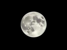 the moon is shown in the dark sky photo