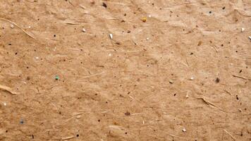 Rustic, natural fiber surface with small specks and an earthy texture. photo