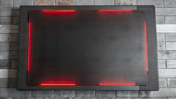 Sleek black table with glowing red edge lights. photo