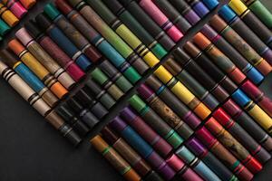 Rows of colorful pencils stacked on top of each other create a vivid scene. photo