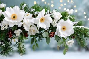 Christmas garland with white magnolia flowers, pine cones and snow against blurred background photo