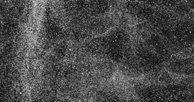 Chaotically moving white particles on a black background. Abstract animation.9990 video