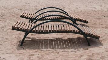 Two empty sunbeds inviting relaxation on sandy beach video