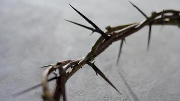 Jesus Crown of thorns casting distinct shadow on a for Christian background, Easter concept, creating a symbolic image of suffering, sacrifice, and remembrance video