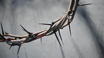 Jesus Crown of thorns casting a distinct shadow on a for Christian background, Easter concept, creating a symbolic image of suffering, and remembrance video