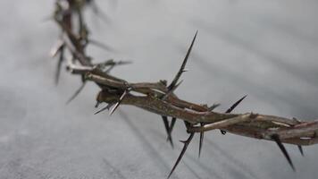 Crown of thorns resting on a neutral background, evoking the sacrifice and resurrection of Jesus Christ during easter 4k video